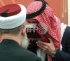 Prince  Hamzah  receives  The  Holy  Kuran  as a gift.